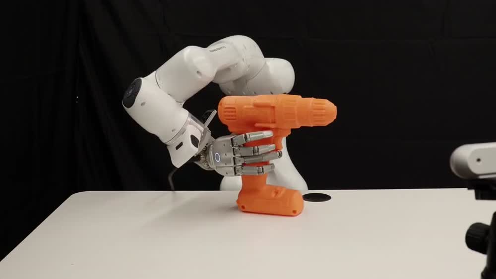 Real robot · executing a video-derived plan